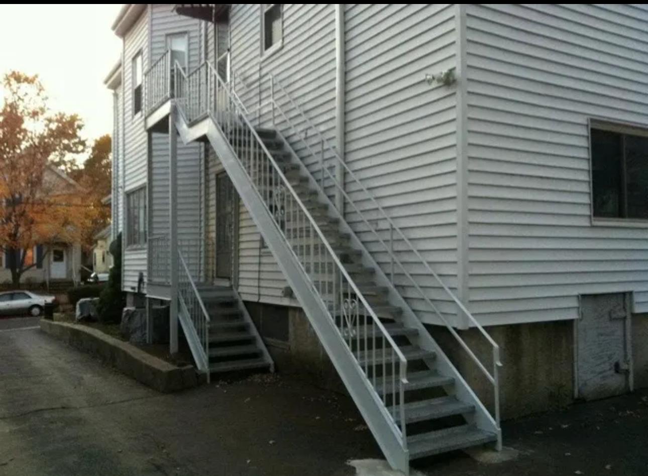 Painted steel exterior stairs on a multi-family residential building