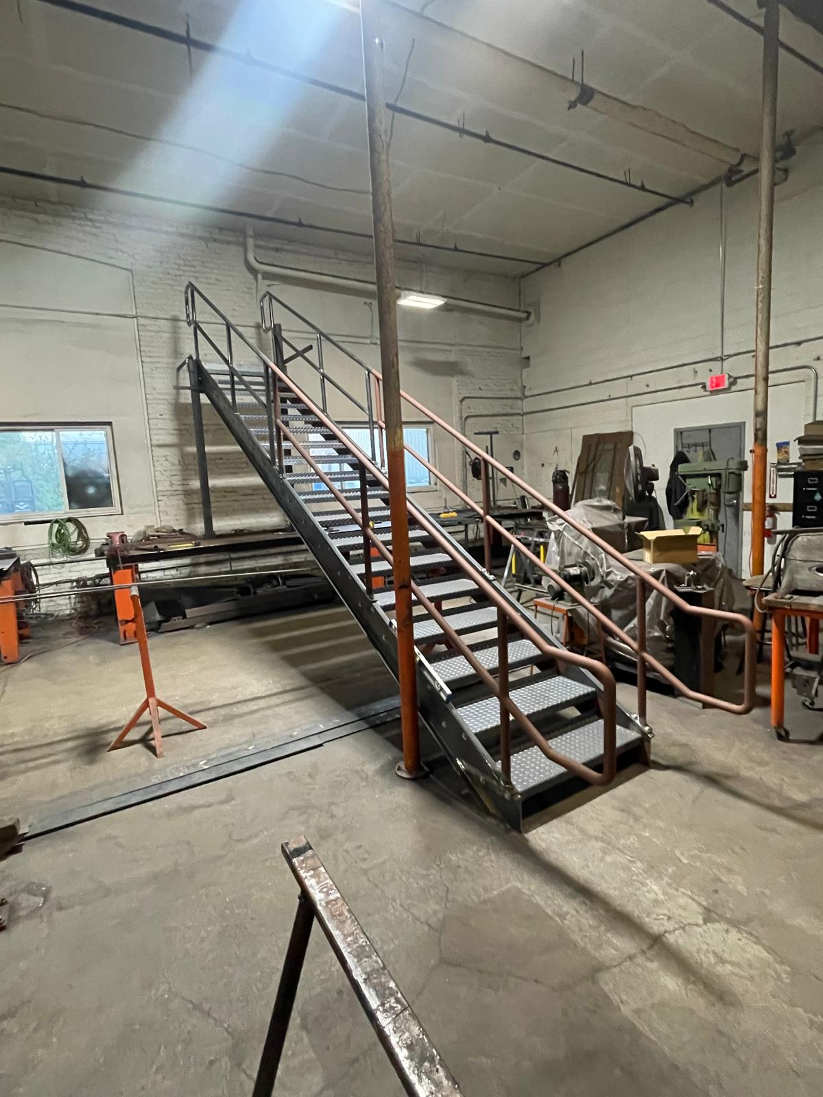 Steel stair with diamond plate treads assembled in the fabrication shop